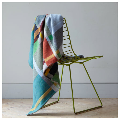 Fieldon Premium Merino Lambswool blanket on back of green chair