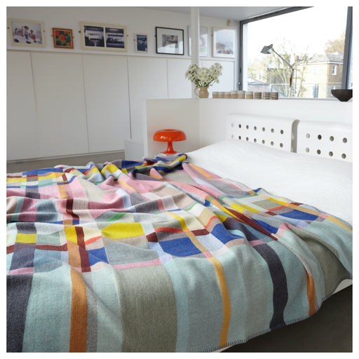 Large Wallace Sewell Lloyd Premium Australian Merino wool blanket on bed