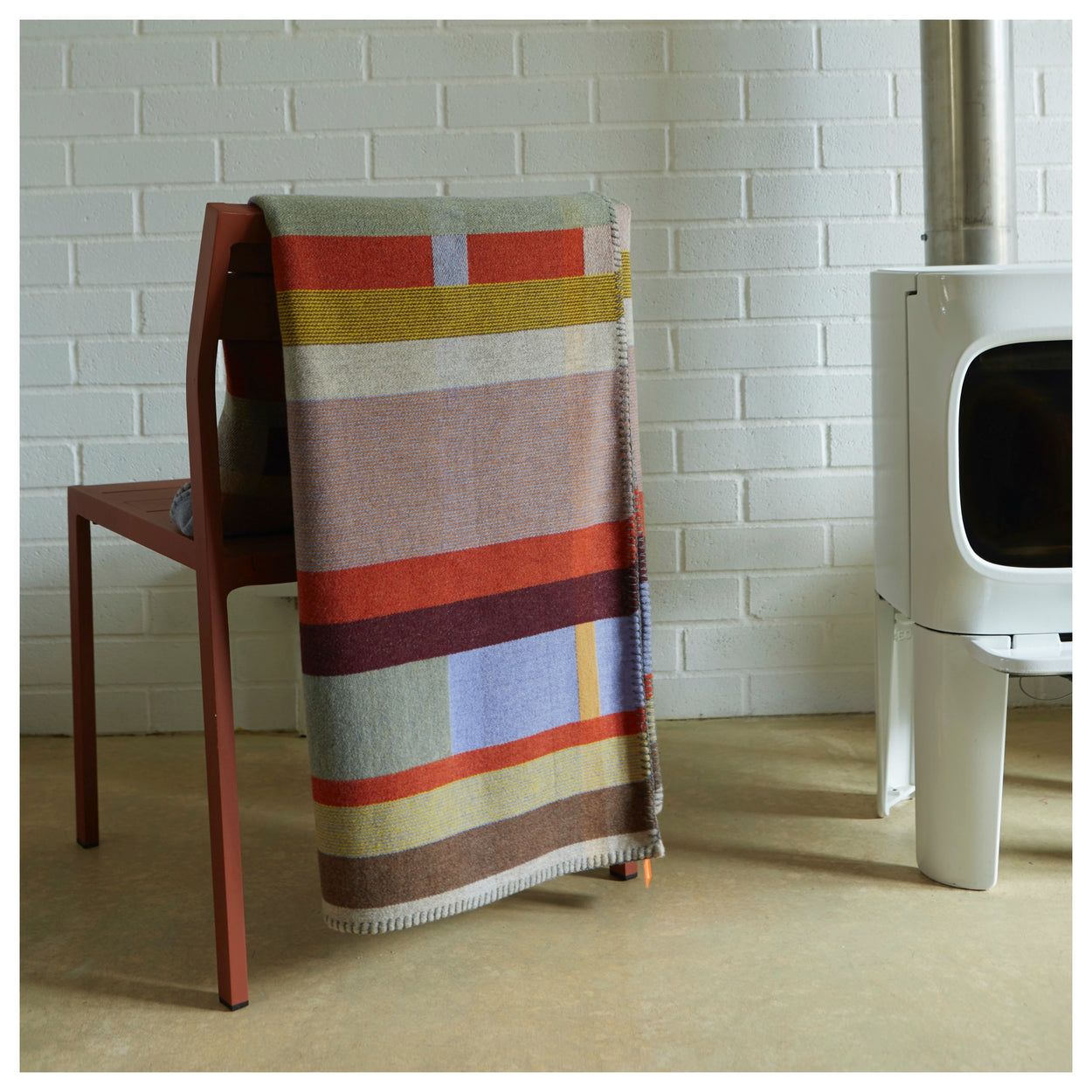 Cecil Orange and brown Premium Merino Lambswool wool throw blanket on chair