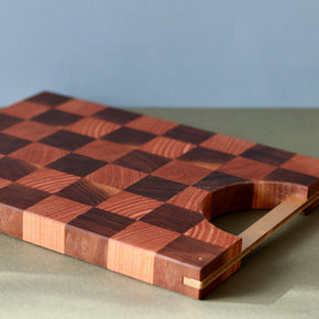 Handmade checkered Oak and Walnut cutting board closeup side profile