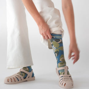 Woman in white jeans wearing Bonne Maison Clover Socks with beige jelly sandals