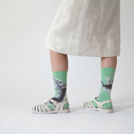 Woman wearing Bonne Maison Dog Socks with white skirt and white sandals