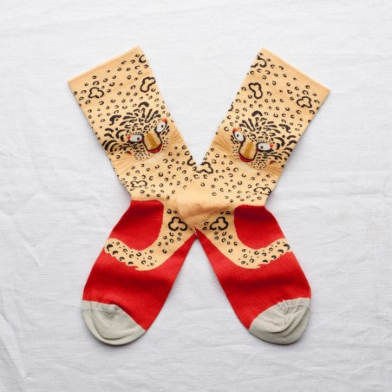 Bonne Maison Leopard Socks lying flat with white backdrop