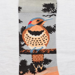 Close up of Bonne Maison Paradise Rain Bird Socks lying flat with white background