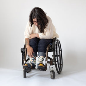 Woman in wheelchair wearing Bonne Maison Plant Socks